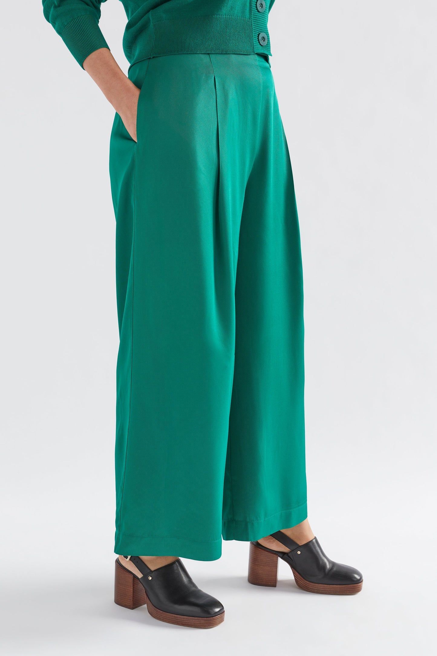Vail High Waisted Wide Leg Pant Model Side with Cardigan | JEWEL GREEN