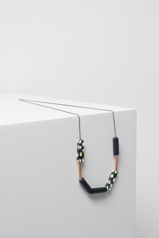 Painted Poppy Printed Timber Necklace Side Angled | CHARCOAL